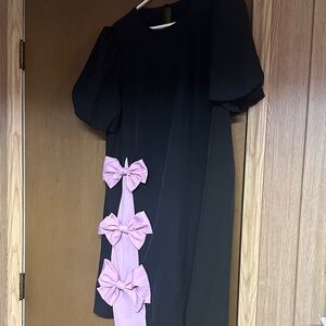 Elegant Black Dress with Pink Bow Accents